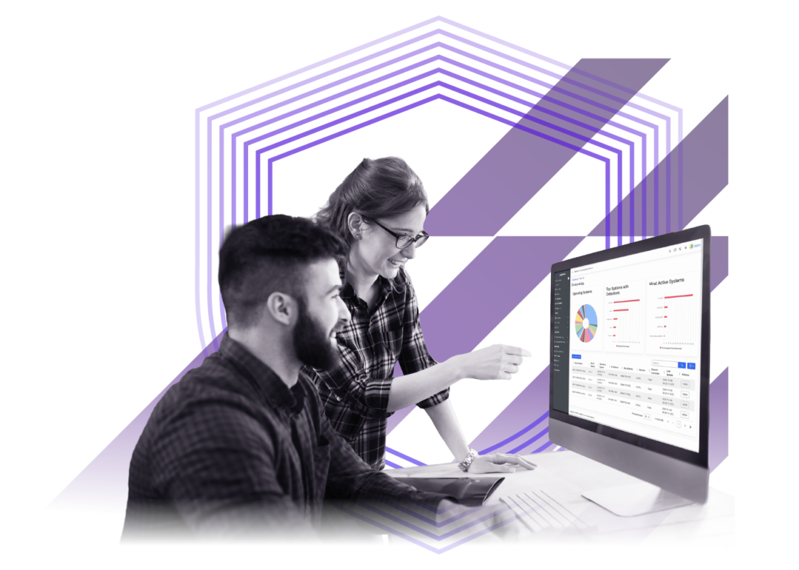 Two IT professionals reviewing security analytics on a desktop monitor, with dashboard charts and layered shield graphics representing managed detection and response services.