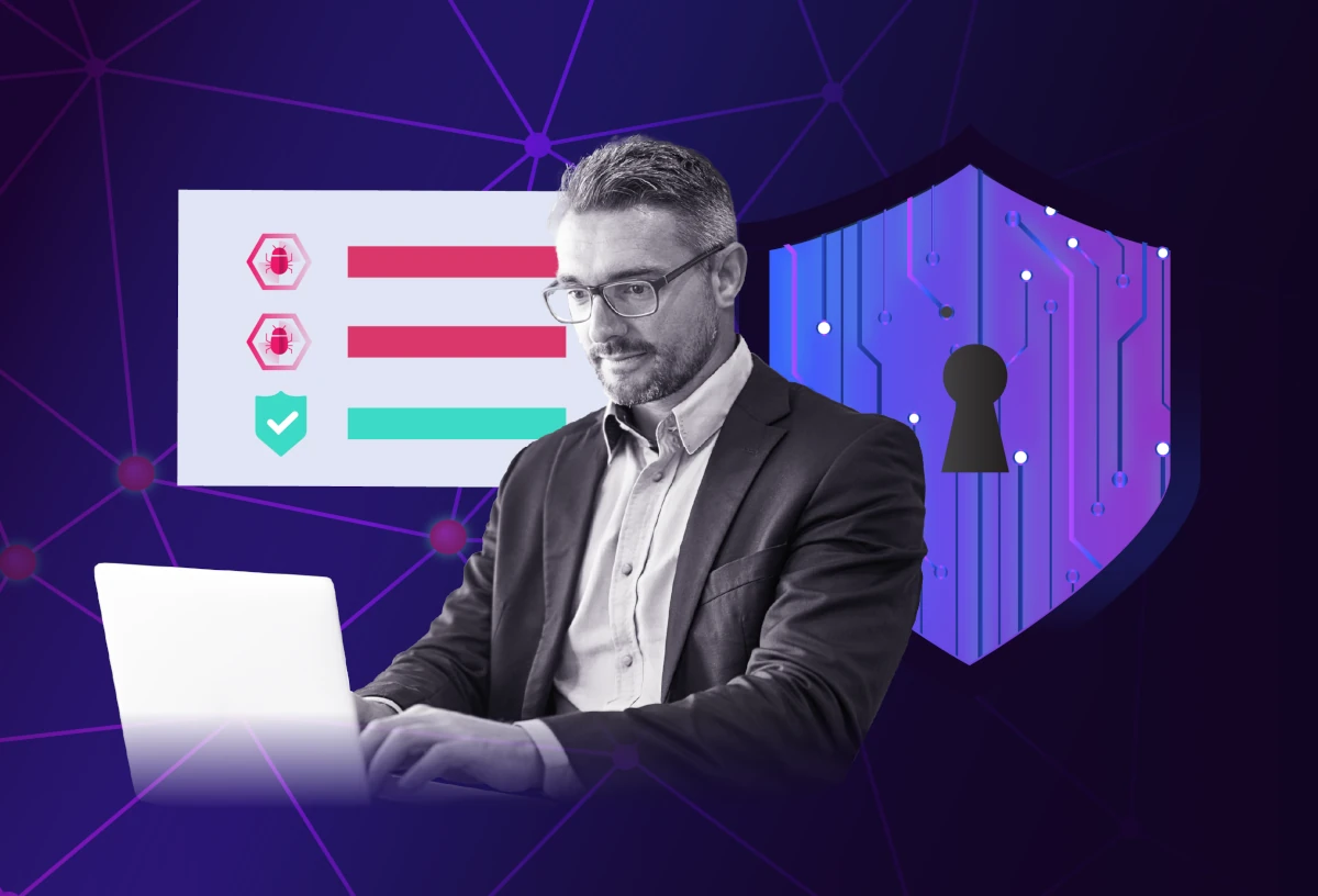 Person using a laptop with a cybersecurity dashboard and shield lock icon, representing ransomware protection and threat monitoring.